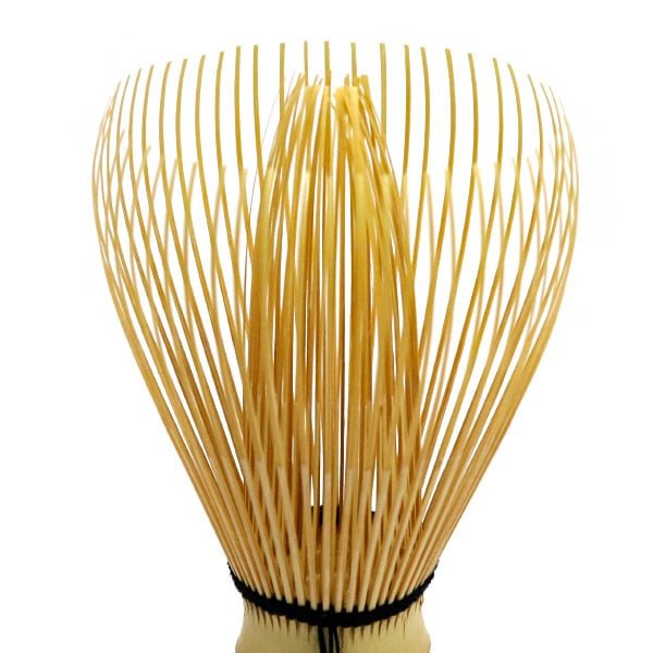 Fine tines of handmade white bamboo matcha whisk
